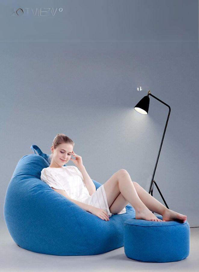 person reading on LUCKYSAC Classic Bean Bag with foot stool blue