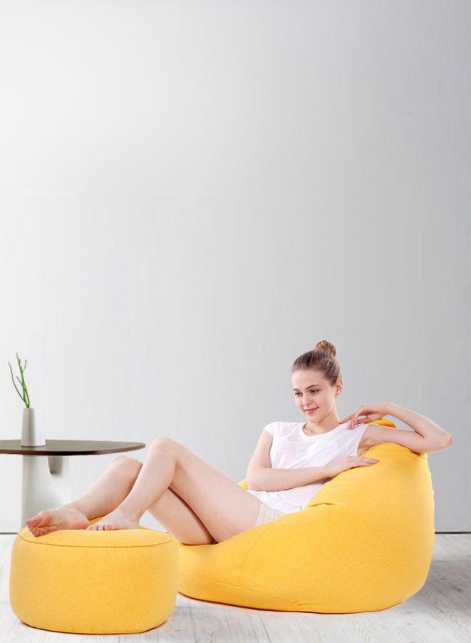 LUCKYSAC Classic Bean Bag with foot stool yellow being used