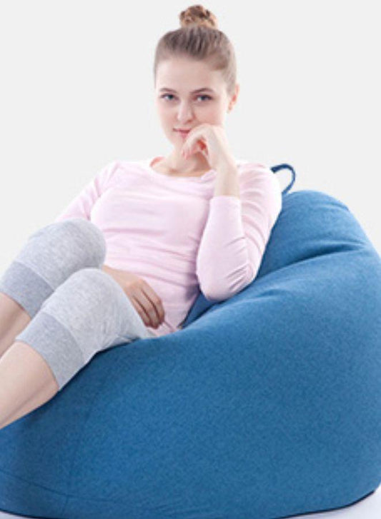 LUCKYSAC Classic Bean Bag with foot stool blue being used
